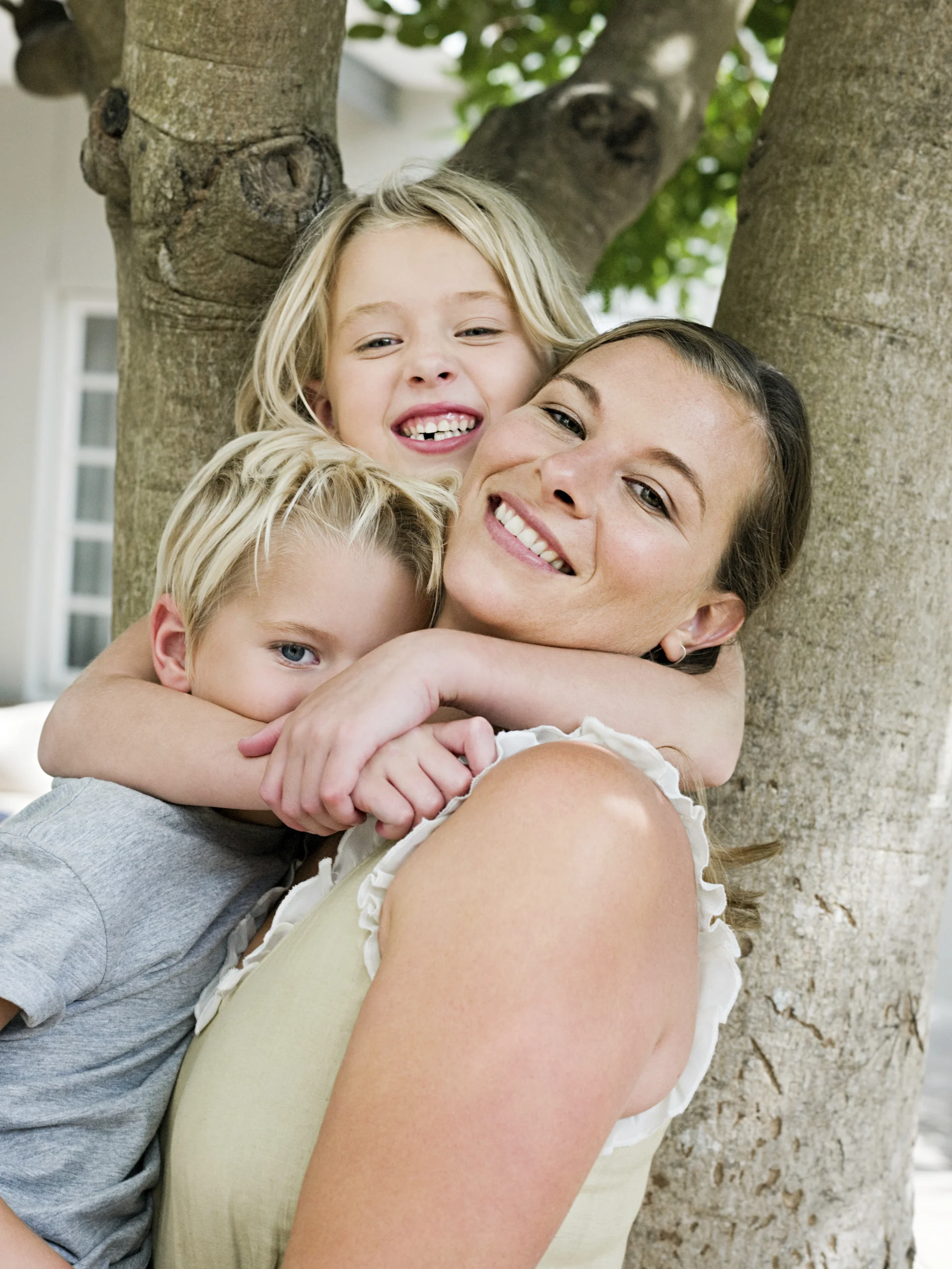 mother-with-son-and-daughter-by-tree-2026-01-09-09-28-17-utc